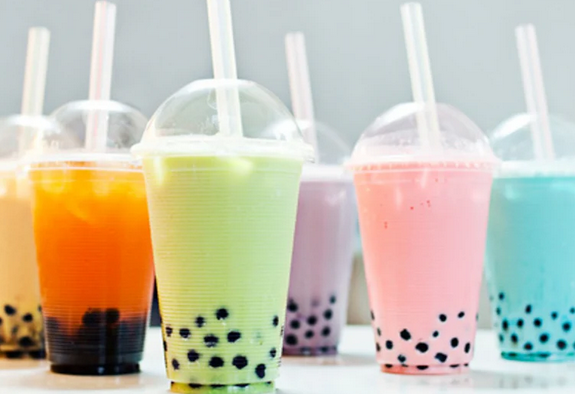 a row of boba tea cups